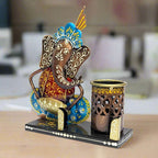 A sturdy metal pen holder with a card slot, featuring a beautiful Ganesha design.