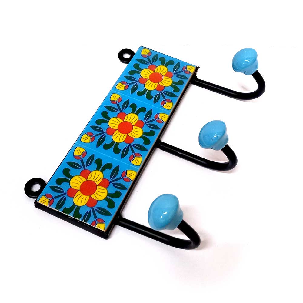 A traditional 3-hook Blue Pottery coat hanger with hand-painted patterns.