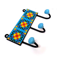 A traditional 3-hook Blue Pottery coat hanger with hand-painted patterns.