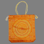 A traditional Banarasi silk handbag with fine quality zari work, a beautiful accessory.