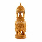 Side profile of a traditional Indian wooden elephant with royal Howdah carriage.