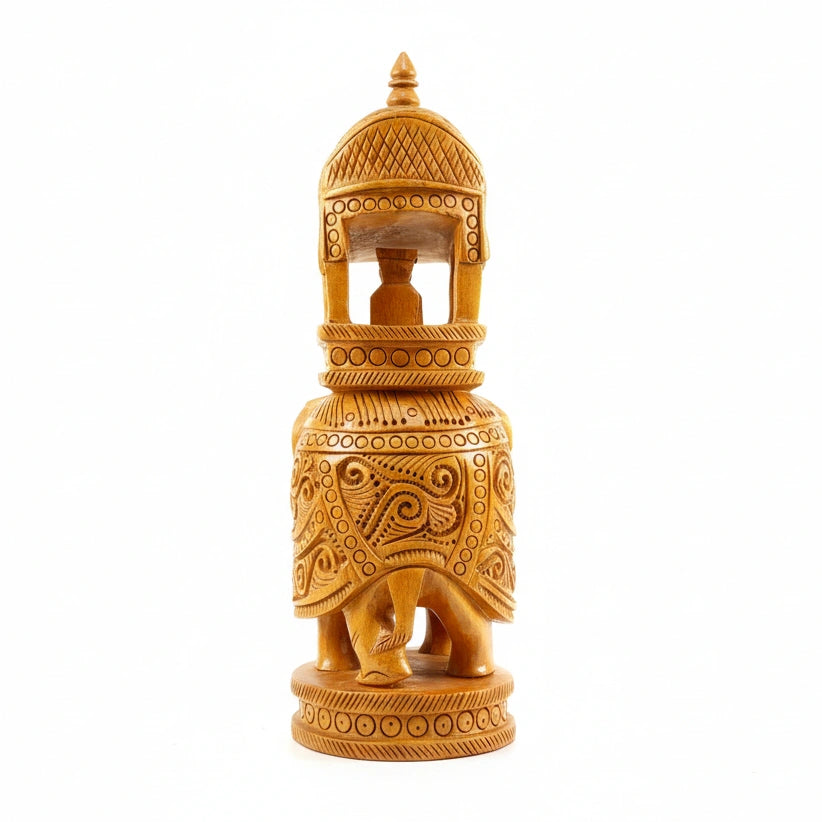 Side profile of a traditional Indian wooden elephant with royal Howdah carriage.