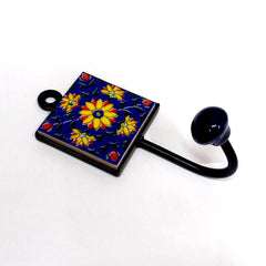 A traditional Jaipuri Blue Pottery coat hanger with hand-painted patterns.