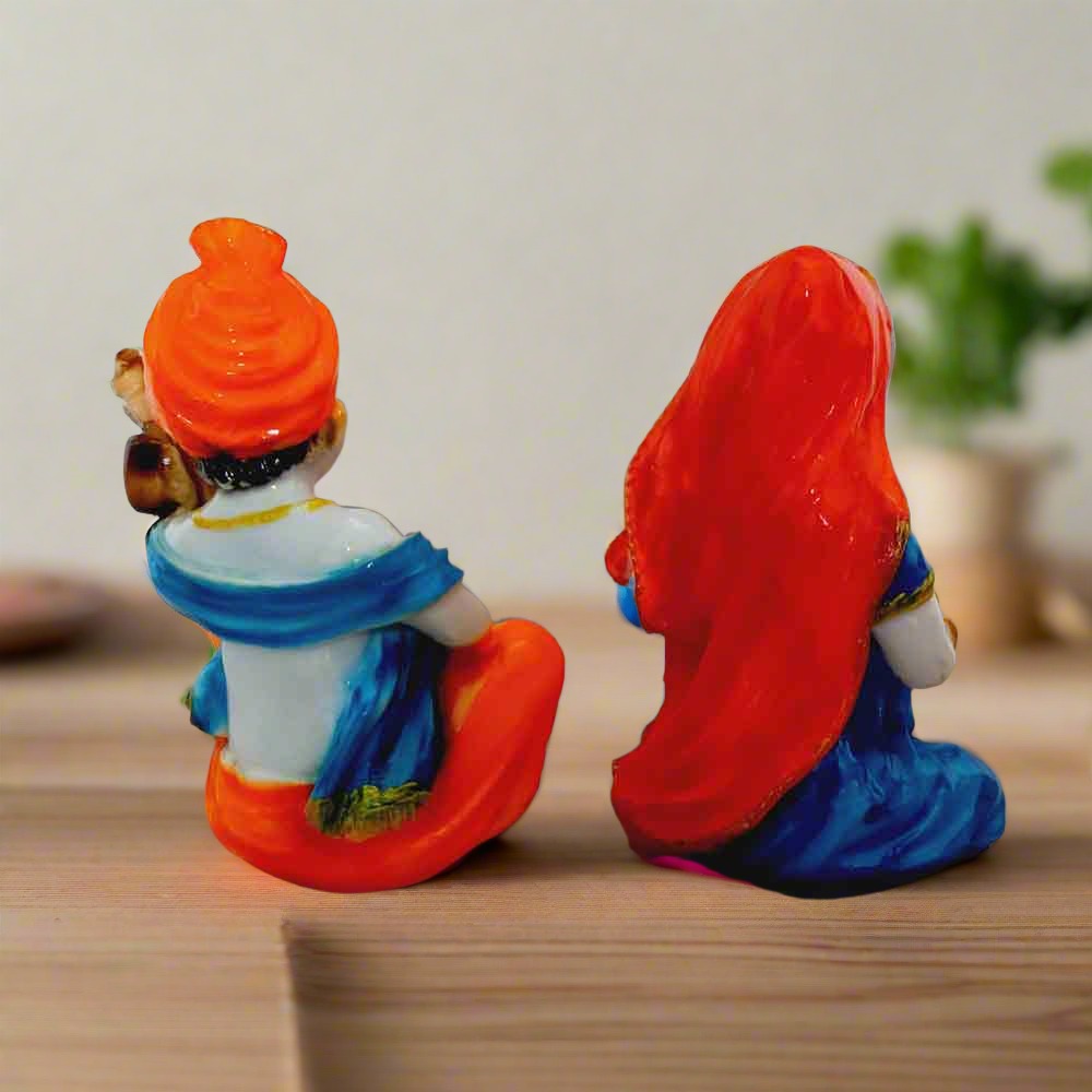 Traditional Indian handicraft Rajasthani couple idols in multicolor design