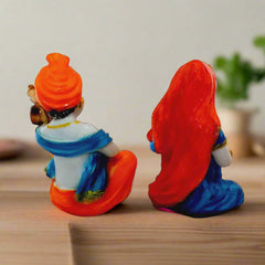 Traditional Indian handicraft Rajasthani couple idols in multicolor design