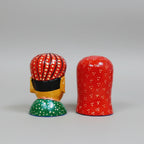 Handcrafted wooden figurine showing traditional Rajasthani attire and jewelry details.