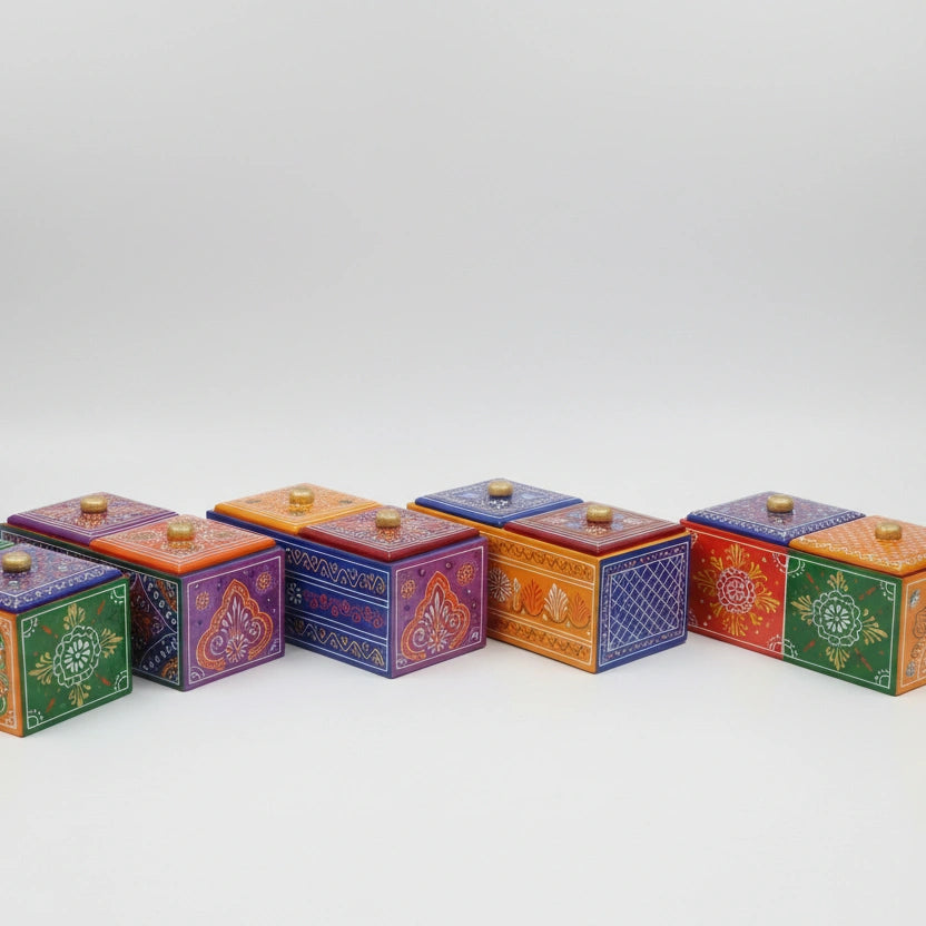 Close up of the hand-painted floral motifs on the wooden utility and dry fruit box.