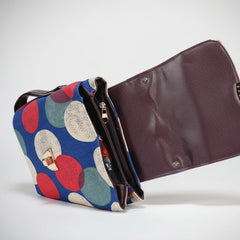 View of 3 zip compartments including 2 main and 1 back side zip on a printed bag