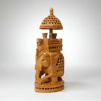 Close-up of the meticulous jali work showcasing the hollow interior of a single-piece wood carving.
