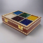Unique gemstone wooden jewelry box with golden lock and artistic design.