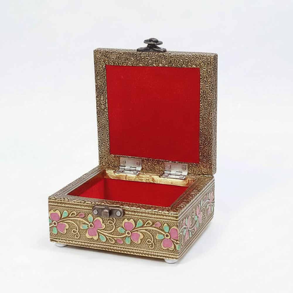 Soft velvet lined interior of peacock design box protecting jewelry or dry fruits securely.