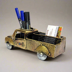 A vintage car model pen holder that enhances the beauty of your office desk.