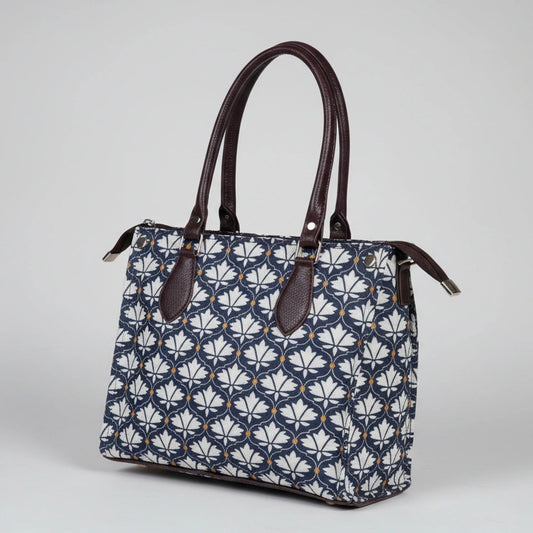 Close-up of the strong PU leather handle on the women's floral cotton handbag.