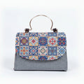 Women's floral embellished sling bag in high quality fabric with golden handle