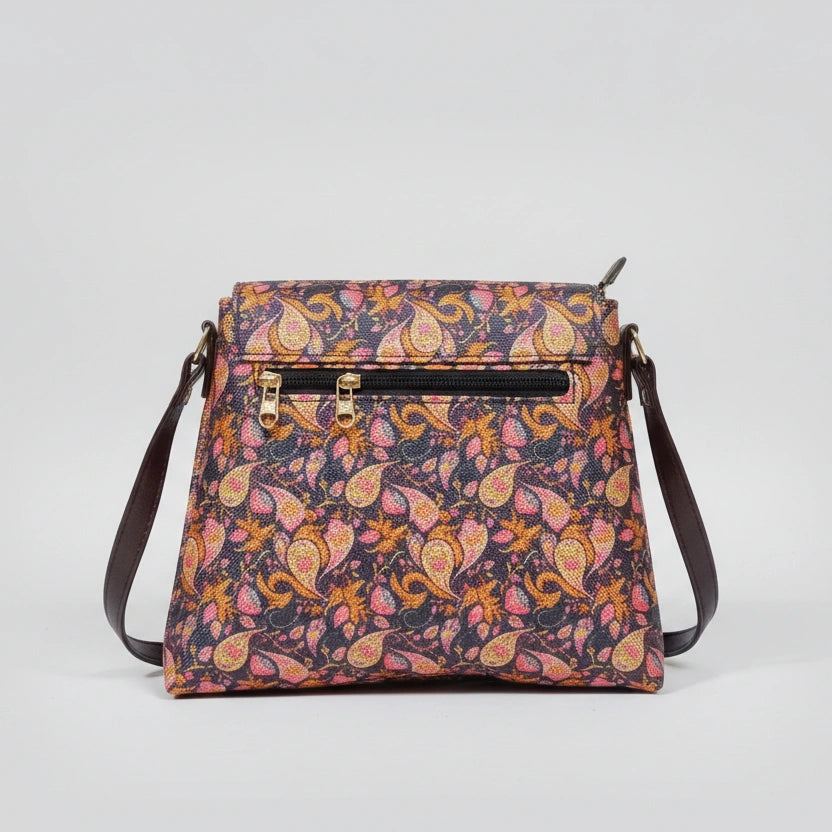 Rear view of the floral bag showing the slim profile and the secure zipper pocket designed for a woman's smartphone.