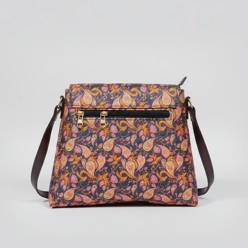 Rear view of the floral bag showing the slim profile and the secure zipper pocket designed for a woman's smartphone.
