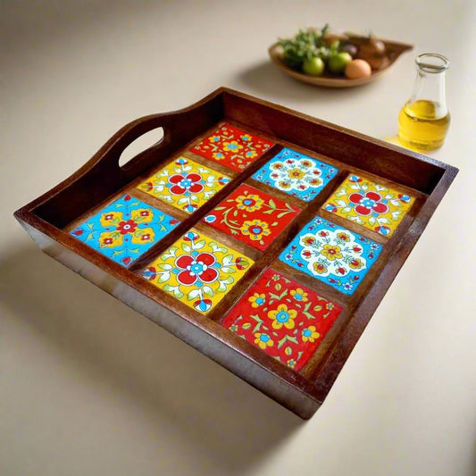 Handcrafted wooden serving tray with vibrant blue pottery tile design.