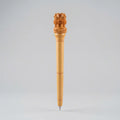 Wooden pen with a carved Ashoka Lion Capital top and fine ring details, front view