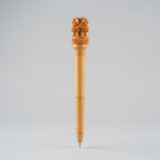 Wooden pen with a carved Ashoka Lion Capital top and fine ring details, front view