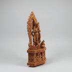 Wood carving Krishna idol with kalash and peacocks — traditional Rajasthani handicraft