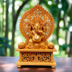 Beautiful wood carving sitting Ganesh statue made of Kadamba wood with fine detailing.
