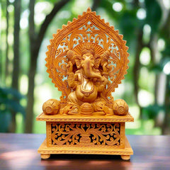 Beautiful wood carving sitting Ganesh statue made of Kadamba wood with fine detailing.