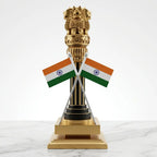Front view of wooden Ashoka Stambh with two crossed Indian flags, golden carved detailing and a stepped square wooden base