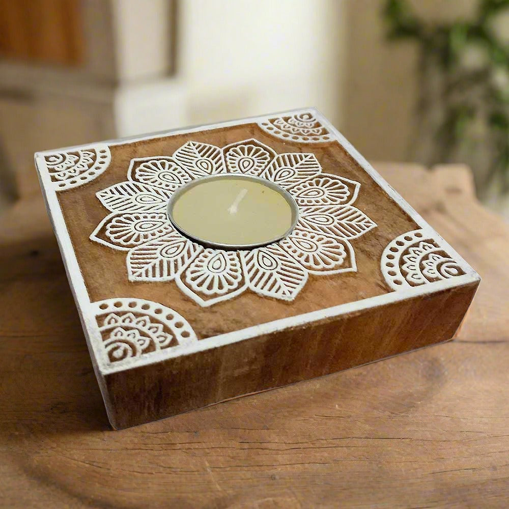 A simple, solid wooden block candle holder for a single candle.