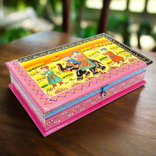 A small wooden box featuring a beautiful miniature painting on its lid.