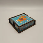 The wooden coaster set in its stand, presented as a gift with premium packaging for housewarming or birthdays.