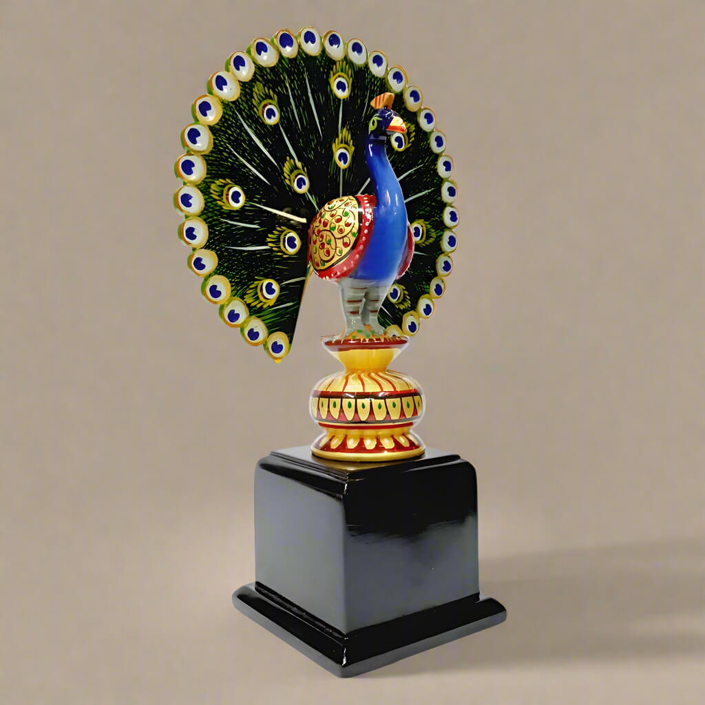 Wooden dancing peacock showpiece made from dried quality wood, decorated with hand painting, mounted on a wooden platform.