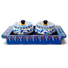 A hand-painted wooden dining table set with trays and containers, enhancing your home's beauty.
