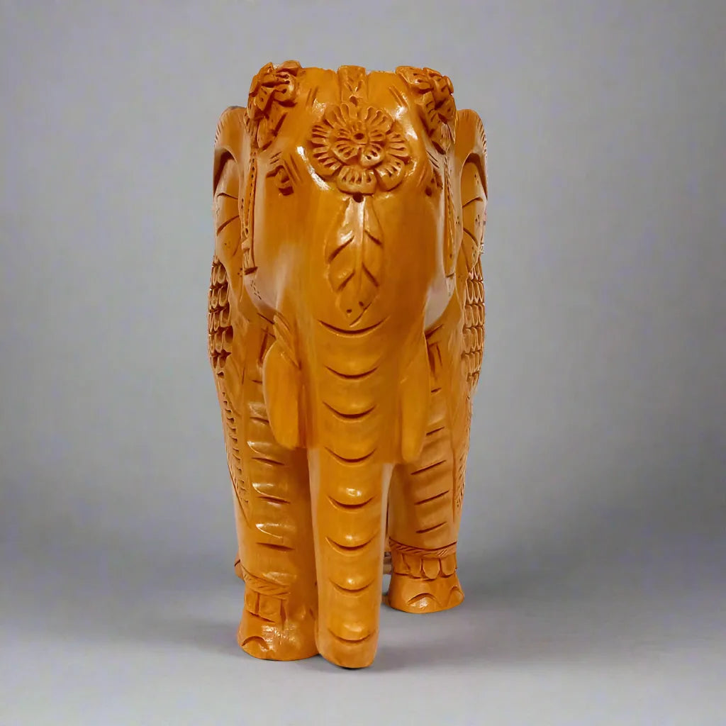 Traditional wooden elephant idol, unique Indian handicraft piece.