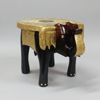 Handcrafted wooden elephant stool featuring intricate hand-hammered brass work.