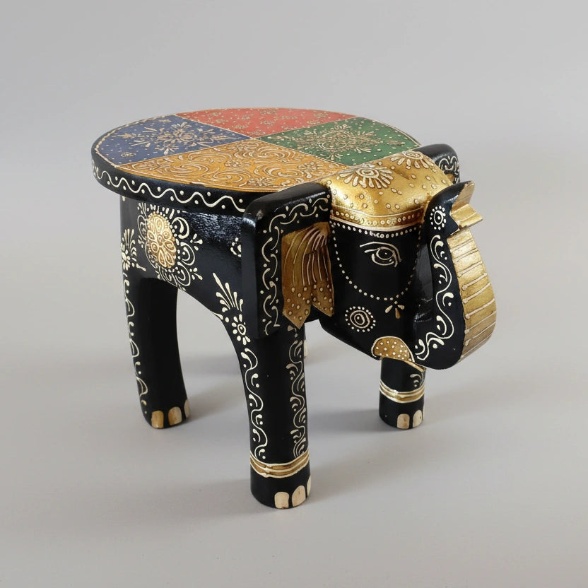 Intricate hand-painted elephant plant stand with raised gold and color motifs from Jaipur.
