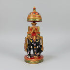 Top view of a wooden elephant featuring a golden umbrella with multicolor paint.