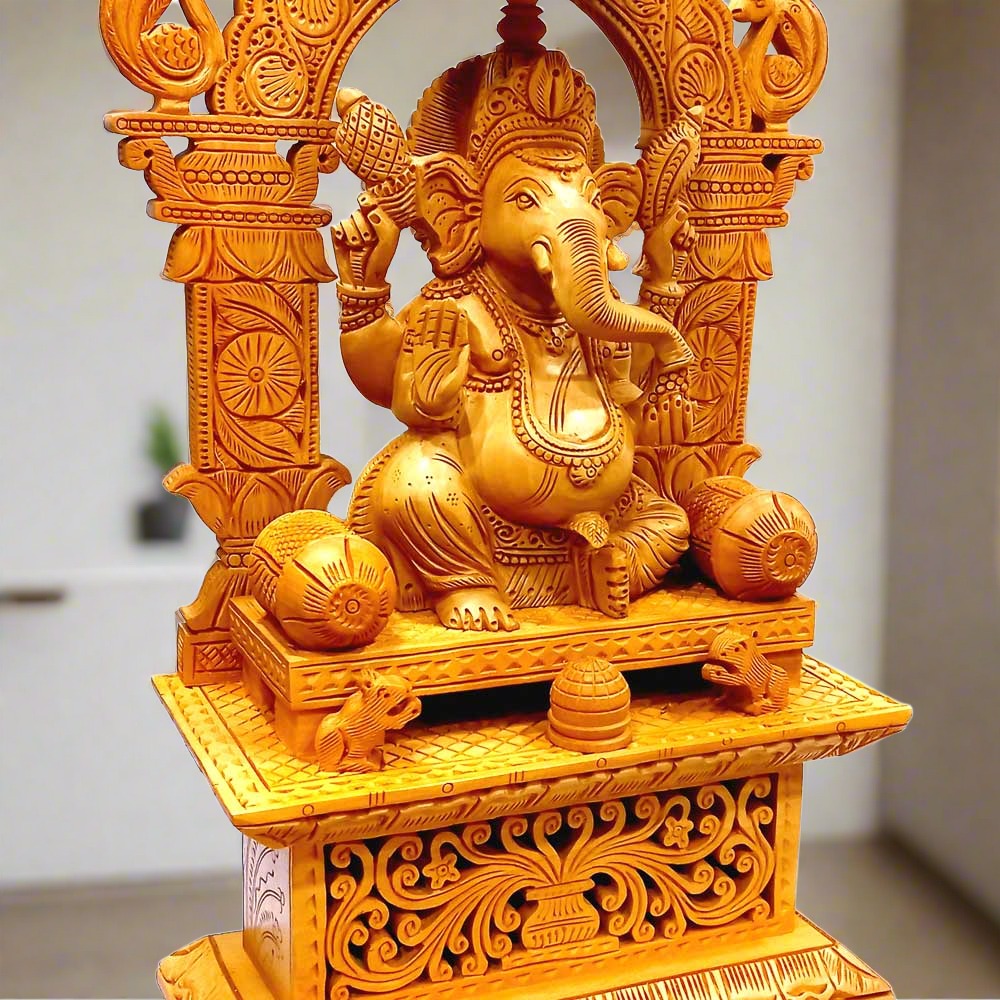 A wooden Ganesh Ji idol with a beautifully carved umbrella design on the arch.