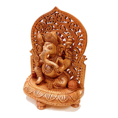 Exquisite wooden Ganesha idol with detailed Mehraab arch backdrop, excellent gift for religious occasions