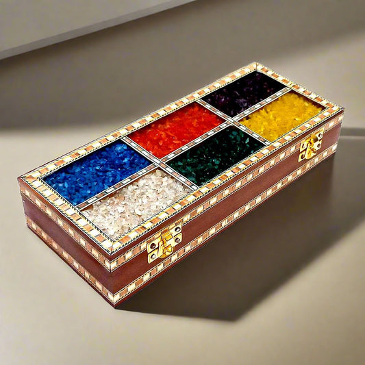 Wooden jewelry box decorated with colorful gemstone artwork.