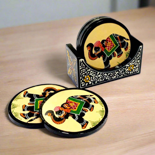 A wooden coaster set with detailed hand-painted elephants on each coaster and an embossed holder.