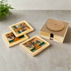 Square glass coasters with miniature artwork of lady, elephant, and Taj Mahal, set in a 360° rotating wooden holder.