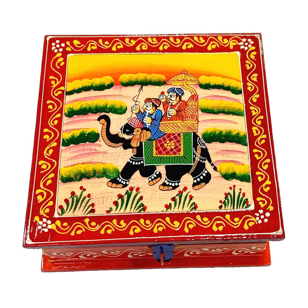 A wooden jewelry chest with a royal Rajasthani painting design.