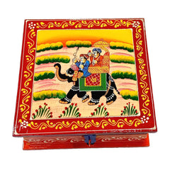 A wooden jewelry chest with a royal Rajasthani painting design.