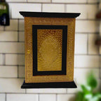 Decorative wooden key holder with a closed-box design and intricate metallic accents for a timeless look.