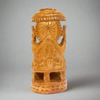 Elegant wooden Ganesh idol featuring traditional craftsmanship and umbrella motif