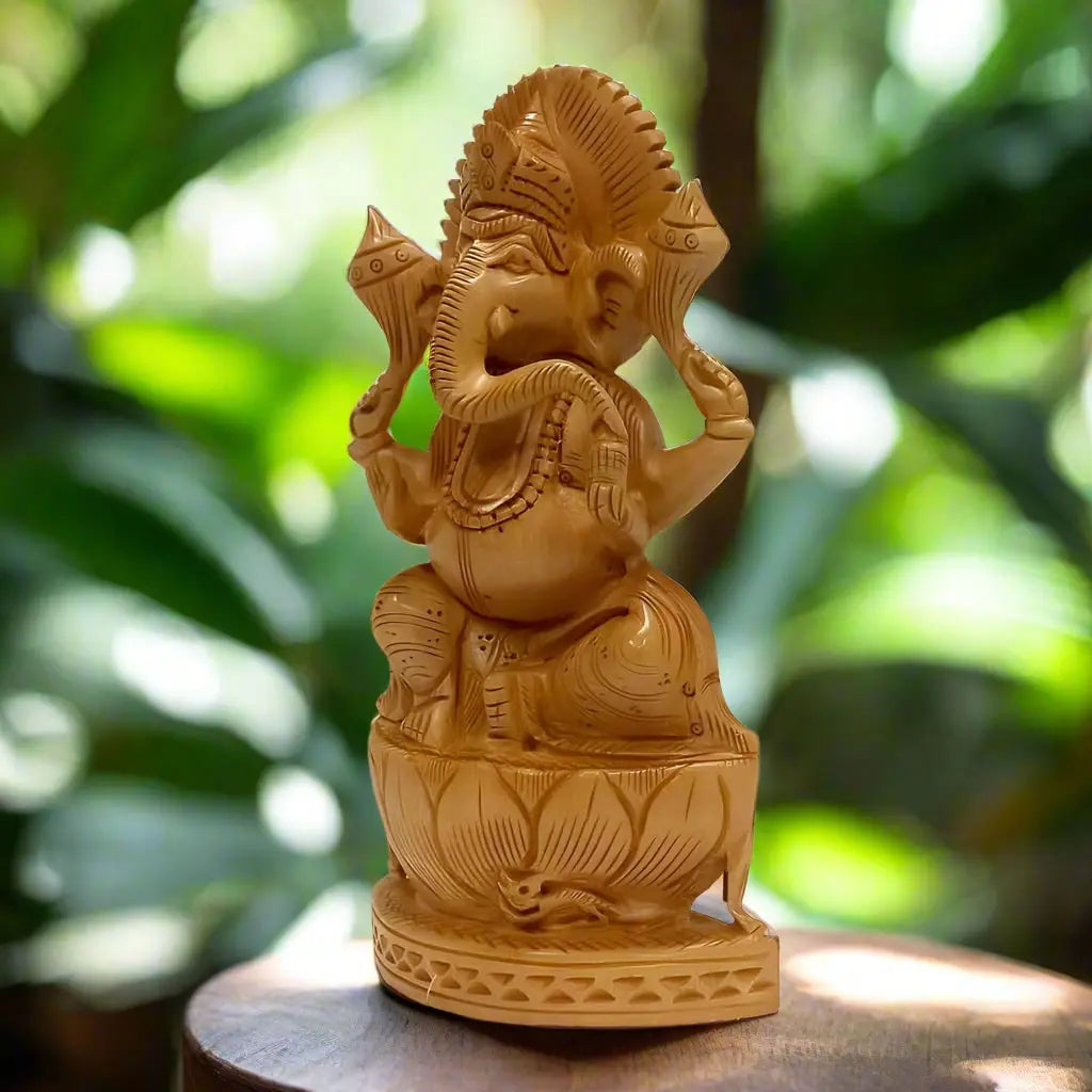 Angled view of wooden lotus Ganesh showing the curved trunk, carved jewellery and layered lotus petals