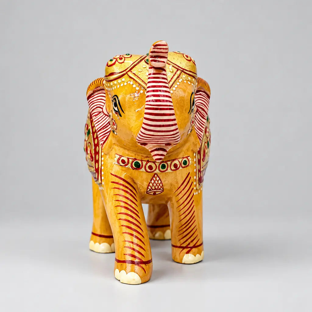 Handicraft wooden elephant direct front view with Vastu high raised trunk and colorful emboss painting details.