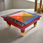 Hand-painted wooden chowki with intricate embossed floral designs