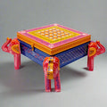 Hand-painted wooden jewelry box with embossed elephant design and carved elephant legs, blending elegance and charm.