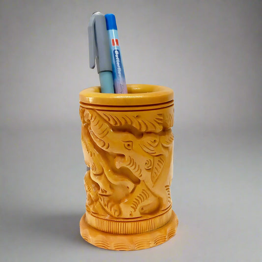 Round wooden pen holder with hand-carved detailing